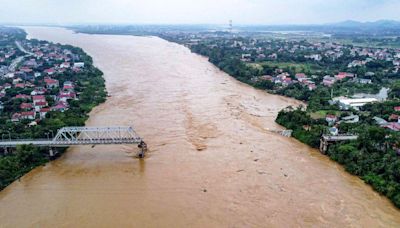 Cars plunge into river as super typhoon destroys Vietnam bridge