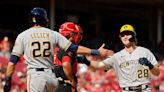 The Milwaukee Brewers score two runs on a pair of fielder's choice grounders in 11th inning to eke out win over Cincinnati Reds