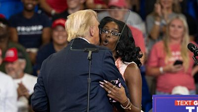 Trump embraces MAGA activist at Atlanta rally who repeats his offensive claims about Harris’ heritage