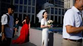 China, battling low birth rates and high costs, encourages frugal weddings