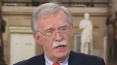 John Bolton admits planning coups d’etat ‘not here, you know, other places’ while discussing January 6