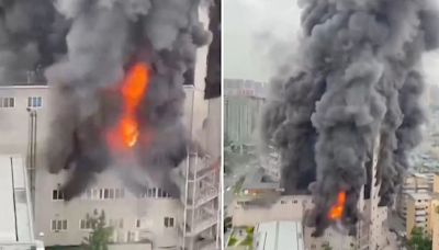 Horror moment huge inferno engulfs 14-storey shopping centre killing 16