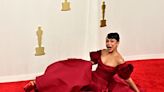 Liza Koshy Takes a Tumble on 2024 Oscars Red Carpet in Sky High Heels, Recovers Like a Pro