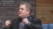 1. Patton Oswalt Wears a Black Blazer and Dress Shoes