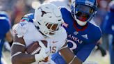 Robinson runs for 243 yards, 4 TDs as Texas routs KU 55-14