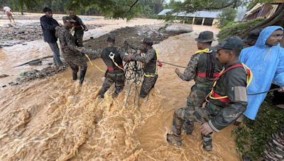 At least 63 dead and hundreds feared trapped in landslides in southern India