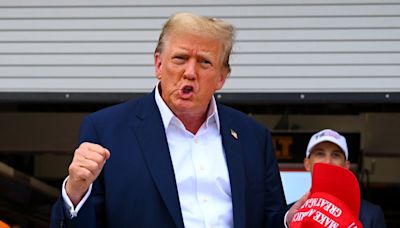 Donald Trump waves to crowd and visits McLaren garage at F1 Miami Grand Prix