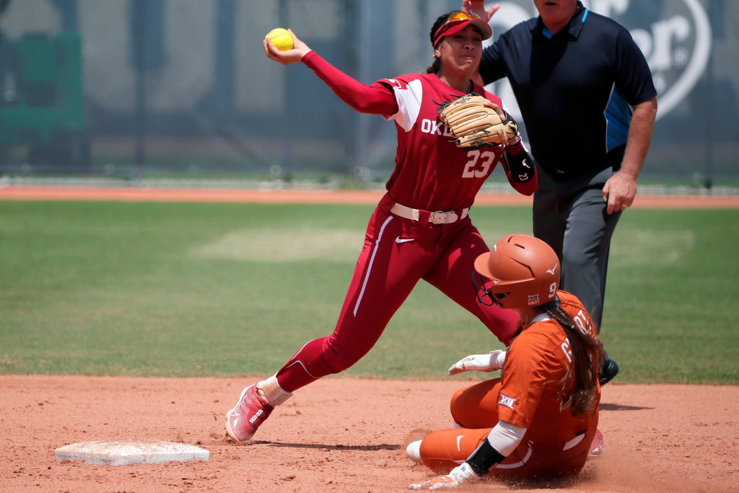 Texas softball HC Mike White wants Women’s College World Series moved
