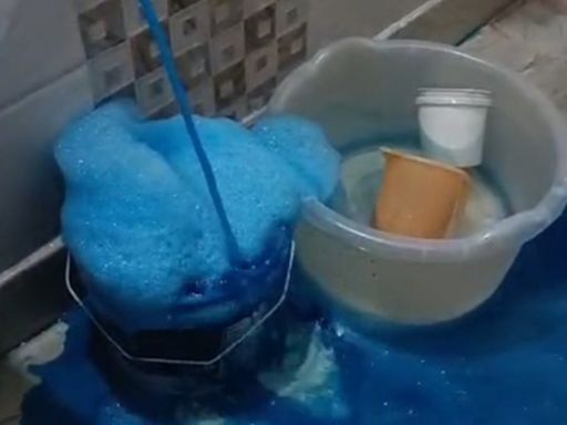 Residents alarmed and mystified as bright blue water flows from taps in homes