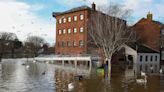 City streets flooded as UK heads for cold spell that could see temperatures dip to -10C