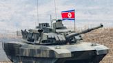 North Korea's Kim 'drives' new tank during mock battle