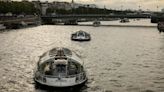 Dozens of boats cruise the Seine river in a rehearsal for the Paris Olympics’ Opening Ceremony