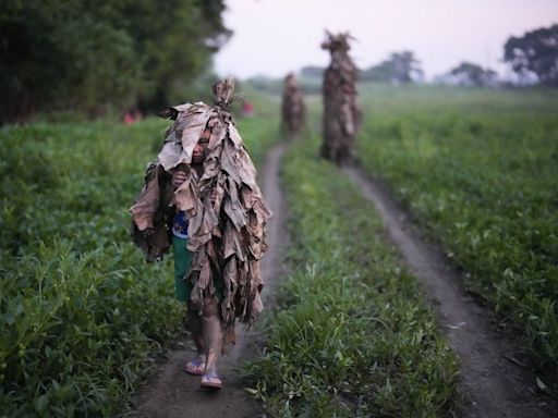 An AP Photographer picked his own path when trying to make the perfect Mud People Festival photo