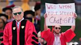 Video shows Warner Bros. CEO David Zaslav struggled to speak at Boston University after protestors booed and told him to 'pay your writers'