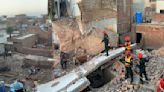 A 3-story building collapses in central Pakistan, killing 9 people and injuring 2 others