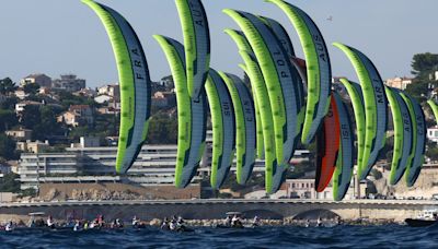 Kiteboarding stages a show as big cats roar offshore