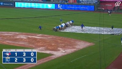 Royals beat Blue Jays in shortened game after umpires stopped tarp from being used
