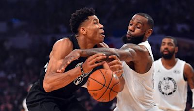 El baloncesto porta la bandera olímpica