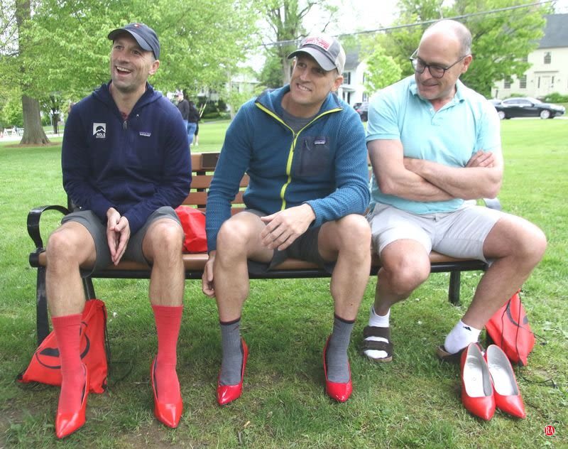 Men and boys strut in red heels in Litchfield to support domestic violence victims