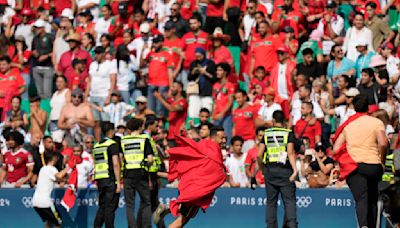 Olympic soccer gets off to violent and chaotic start as Morocco fans rush the field vs Argentina