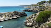 Beautiful seaside town with water so clear boats look like they're 'flying'