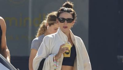 Michelle Keegan flashes her toned abs in black gym wear as she leaves a pilates class at Sydney's Bondi Beach