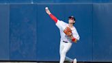 Bobby Dalbec shows off his arm and speed as he adjusts to the outfield