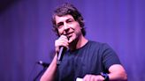 Comedian Arj Barker Asks Breastfeeding Mom to Leave Show After Her Baby Interrupts Set by 'Talking'