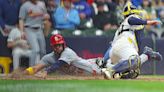 The St. Louis Cardinals' Ivan Herrera slides in safely at home, scoring ahead of the tag from Milwaukee Brewers catcher William Contreras, right, during the sixth inning at American...