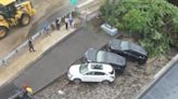 Sinkhole swallows cars in wake of devastating flooding in Massachusetts