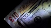 Dollar steady ahead of inflation data; sterling slips after job numbers