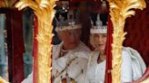 The King and Queen begin procession in Gold State Coach