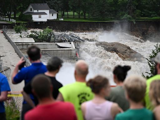 Deadly floods still battering Midwest towns as millions remain under heat warnings