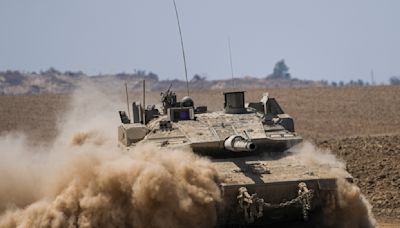 The Latest | Israeli troops launch attacks in central Gaza, possibly widening their offensive