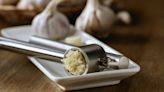 The Everyday Item You Should Be Using To Clean Your Garlic Press