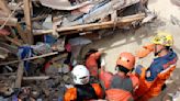 Monsoon rains force halt in Indonesia quake rescue efforts