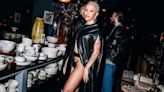 Doja Cat Looks Like a Hot Garment Bag in This Pleather Cape and Thong