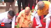 CM Yogi plants sapling as part of plantation campaign - Times of India