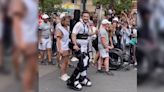 Paralyzed Tennis Player Carries Olympic Torch Using Robotic Exoskeleton
