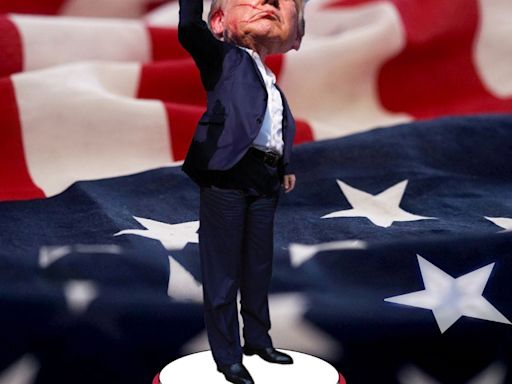 Two new bobbleheads feature bloody Trump with fist in air, another with bandage over ear