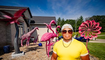 'I'm the king of the jungle': Saylorville man's hot pink statues draw visitors, fights