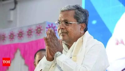 Karnataka cancels plot allocation after row over CM wife's land - Times of India