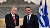 Turkish and Greek leaders turn on the charm in Athens as they vow to leave years of animosity behind