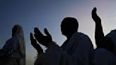 Muslim pilgrims pray at Mount Arafat as hajj reaches apex