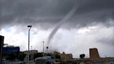 Moment towering waterspout tornado slams into beach sending bathers fleeing