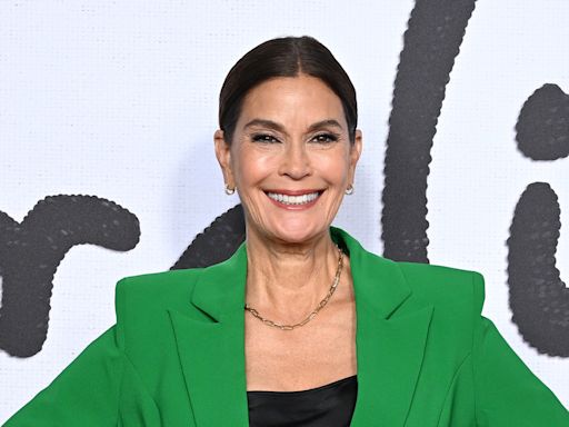 Teri Hatcher, 59, hits the beach in lace-up swimsuit while 'falling in love'