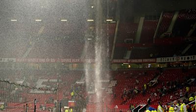 Watch: Manchester United look at new Old Trafford roof after rain gushes into Arsenal dressing room