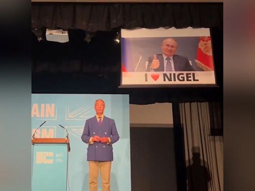 Watch moment Led by Donkeys interrupt Nigel Farage’s speech with huge Putin banner