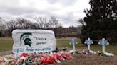 Clashing gun messages at site of Michigan State vigil; thousands mourn slain students: Updates