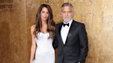 George Clooney holds umbrella for Amal in stylish-but-rainy red carpet appearance